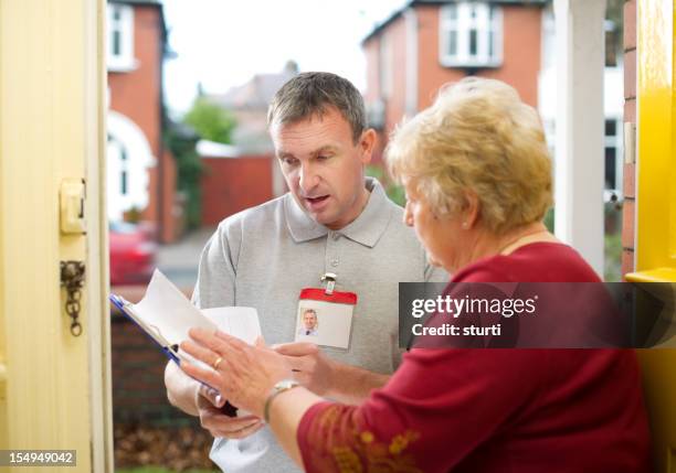 man at the door - door to door salesperson stock pictures, royalty-free photos & images