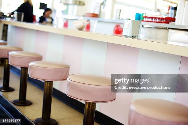 retro ice cream soda shop stools - soda fountain stock pictures, royalty-free photos & images