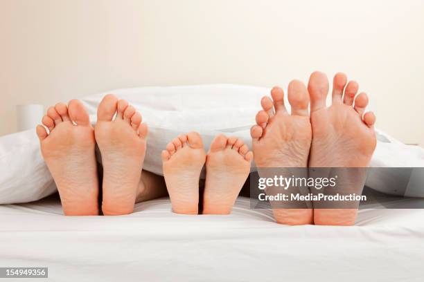 family feet - family feet stock pictures, royalty-free photos & images