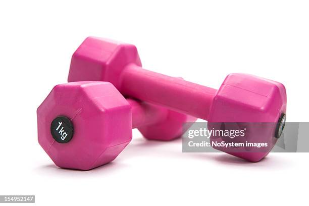 two pink dumbbells on a white background - dumbells isolated stock pictures, royalty-free photos & images