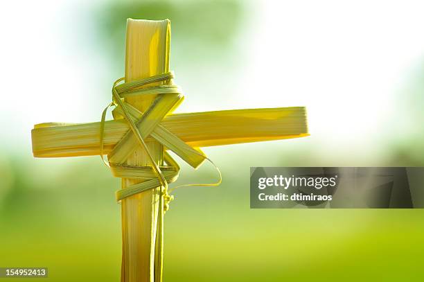 christina cross made out of palm fronds. - jesus palm sunday stock pictures, royalty-free photos & images