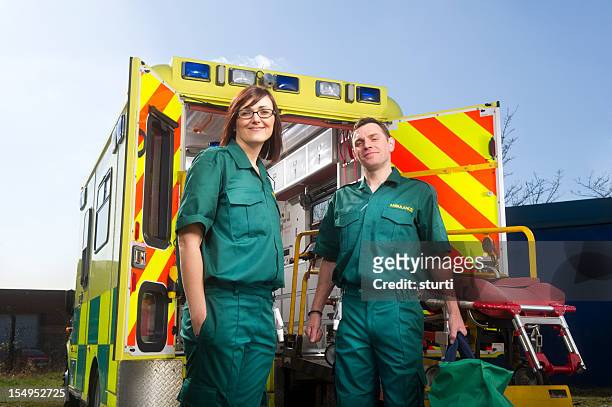 smiling paramedics - ambulance uk stock pictures, royalty-free photos & images