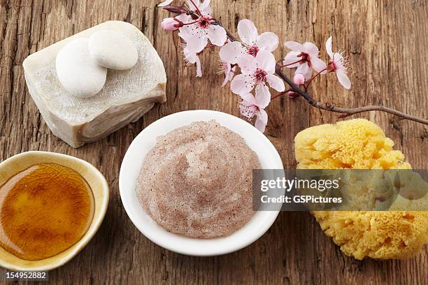 spa still life with cherry blossom, salt scrub and honey - honey face mask stock pictures, royalty-free photos & images