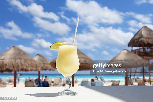 cold cocktail on a tropical beach - daiquiri stock pictures, royalty-free photos & images
