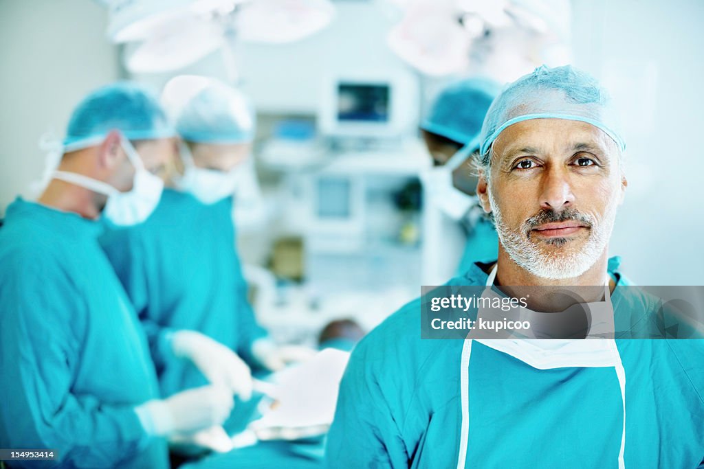 Doctor smiling in operating room