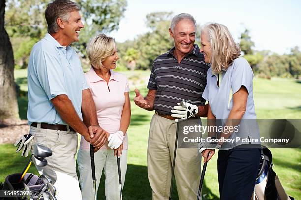 golfing friends joking around - senior men golf stock pictures, royalty-free photos & images