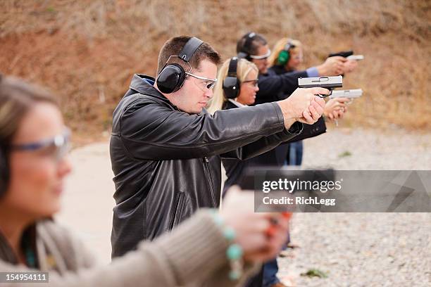 practicing at the shooting range - target shooting stock pictures, royalty-free photos & images