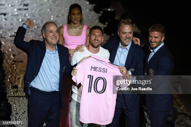 Managing Owner Jorge Mas, Lionel Messi, Co-Owner Jose Mas, and Co-Owner David Beckham pose during "The Unveil" introducing Lionel Messi hosted by...