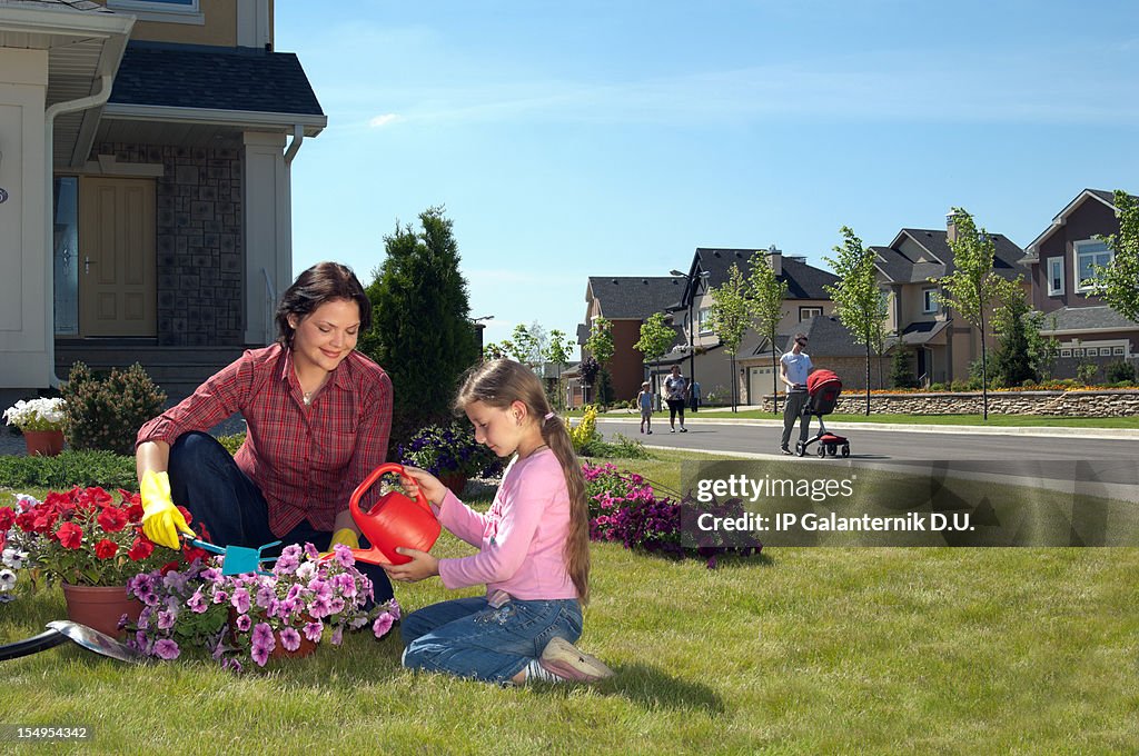 Mother and daughter gardening on