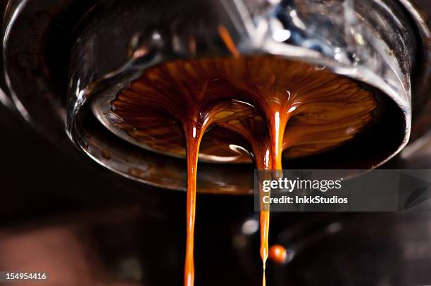 coffee machine pouring out a cappacino - coffee close up stock pictures, royalty-free photos & images