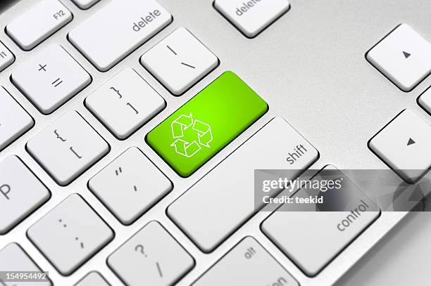 recycle symbol on a computer keyboard-environment protection concept - touchpad stockfoto's en -beelden