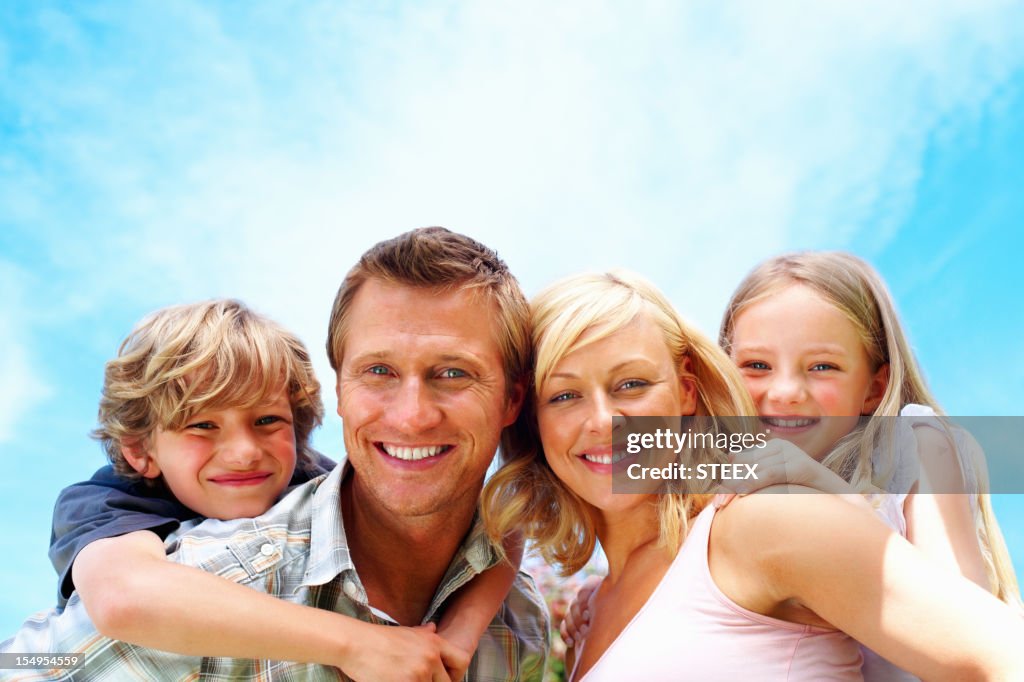 Couple enjoying leisure time with their kids