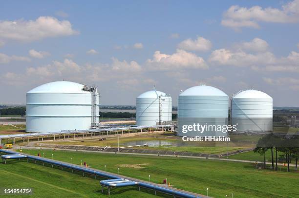 large storage tanks in a factory field - storage compartment stock pictures, royalty-free photos & images