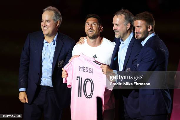 Managing Owner Jorge Mas, Lionel Messi, Co-Owner Jose Mas, and Co-Owner David Beckham pose during "The Unveil" introducing Lionel Messi hosted by...