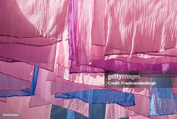 drying dyed fabrics - textile industry stock pictures, royalty-free photos & images