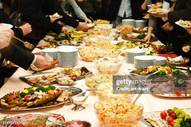 catering table full of tasty food - finger food stockfoto's en -beelden