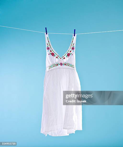 white dress - hanging rope object stock pictures, royalty-free photos & images