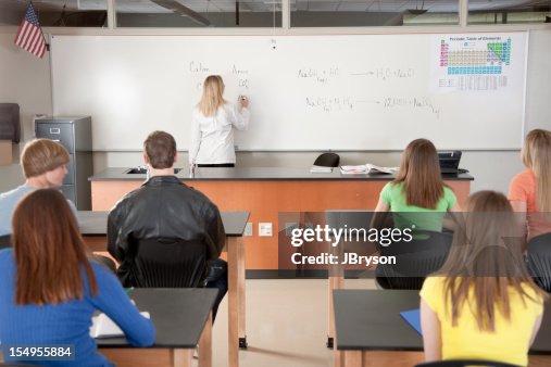 School Science Teacher Instructing Students Learning Chemistry High-Res ...