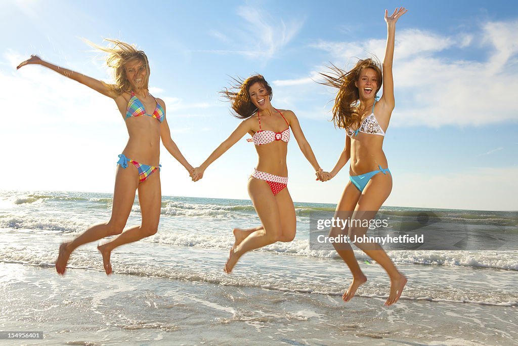 Three young women enjoying the beach