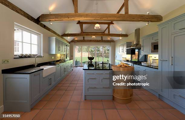 farmhouse kitchen - teak cabinets stock pictures, royalty-free photos & images