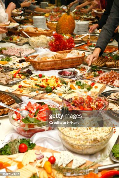 catering table full of tasty food - banquet stock pictures, royalty-free photos & images