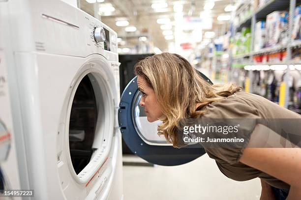 shopping for a washer and dryer - buying washing machine stockfoto's en -beelden