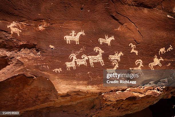 indian cave painting petroglyph - cave painting stock pictures, royalty-free photos & images