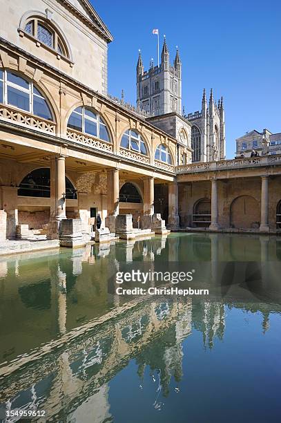 roman baths and bath abbey - roman bath england stock pictures, royalty-free photos & images