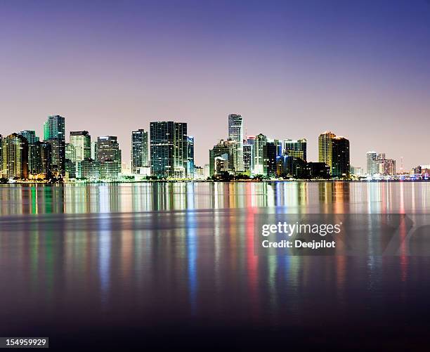 brickell and miami city skyline at night in florida usa - miami skyline night stock pictures, royalty-free photos & images