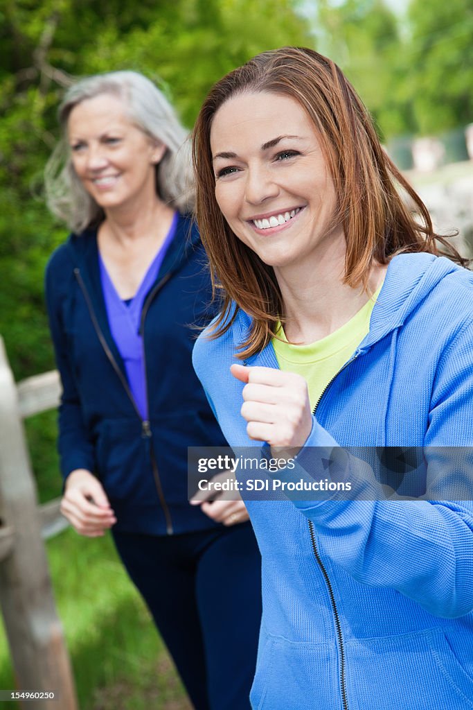 Happy Women Power Walking in a Park
