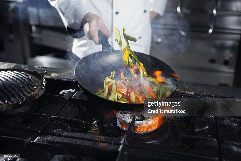 Chef cooking vegetables