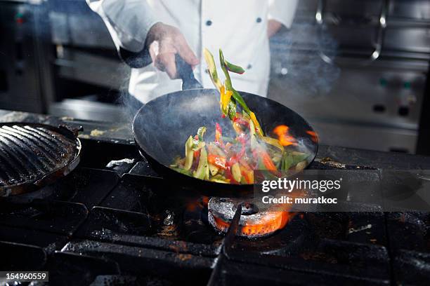 chef cooking vegetables - skillet stock pictures, royalty-free photos & images