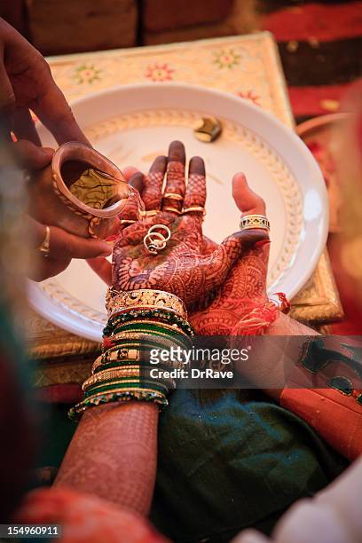 indian bride and groom with rings - wedding ceremony stock pictures, royalty-free photos & images