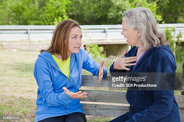 mother and daughter in a disagreement - adults arguing stock pictures, royalty-free photos & images