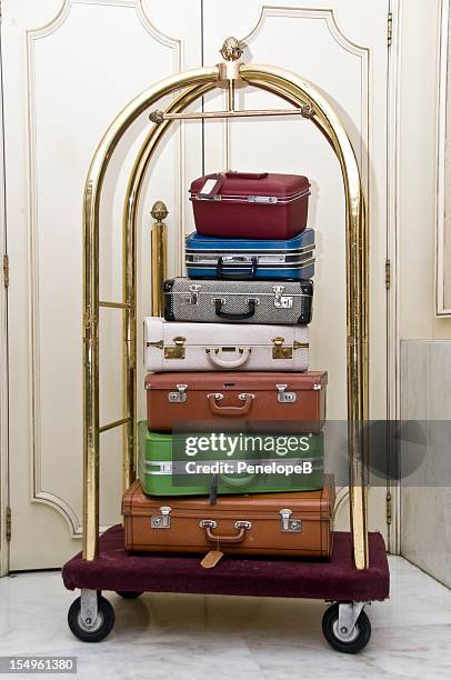 luggage stack on a rack - luggage trolley stock pictures, royalty-free photos & images