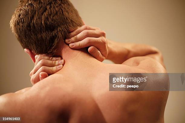 man with neck pain - man touching shoulder stock pictures, royalty-free photos & images