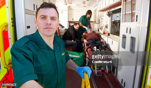 paramedic at the scene - paramedic stock pictures, royalty-free photos & images