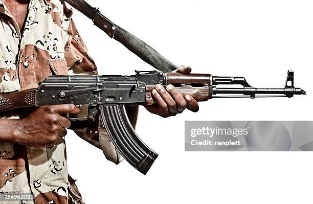 somalian soldier with a machine gun - ak 47 picture stockfoto's en -beelden