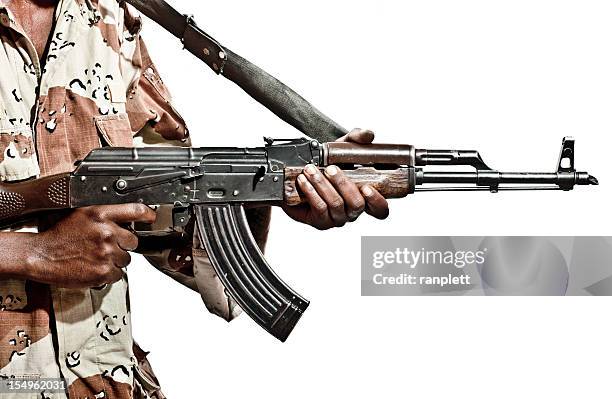 somalian soldier with a machine gun - kalashnikov stock pictures, royalty-free photos & images