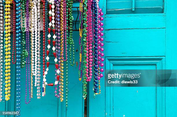 mardi gras beads in new orleans - new orleans stock pictures, royalty-free photos & images