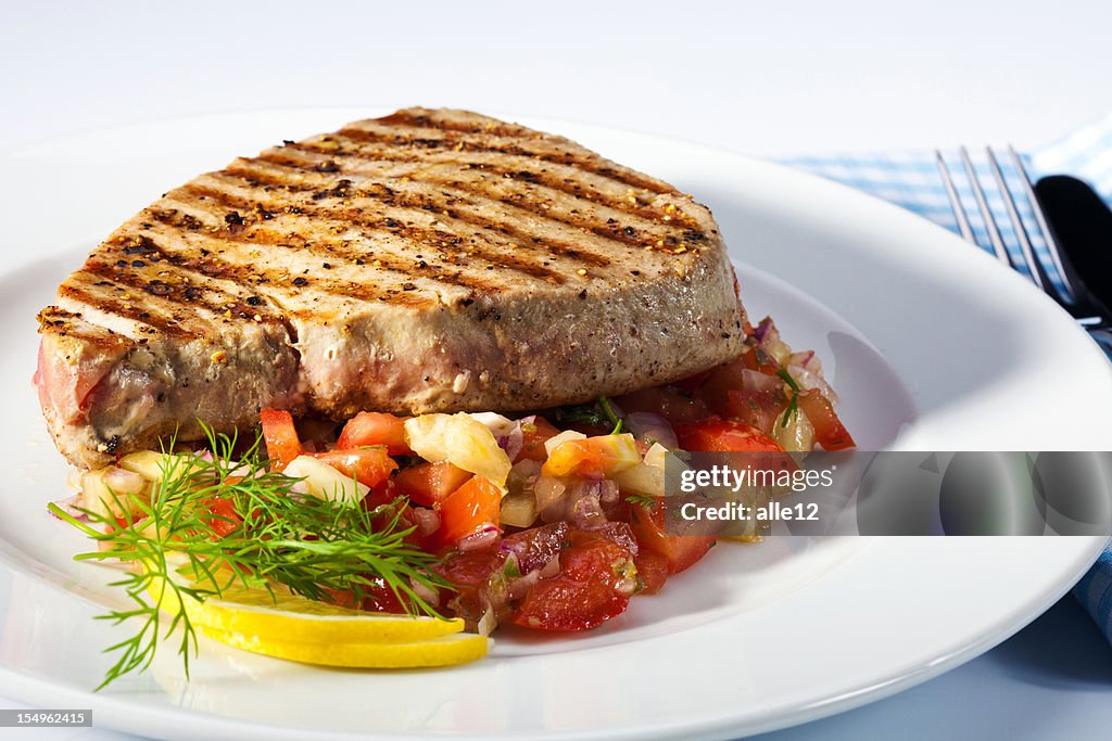 Grilled tuna steak with salad