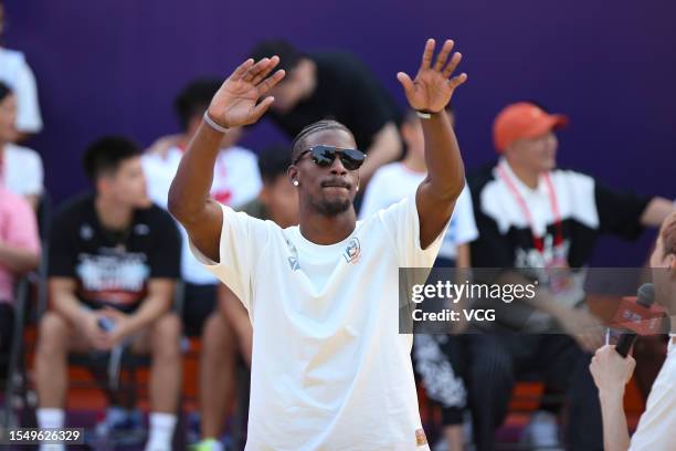 Jimmy Butler, American professional basketball player for the Miami Heat of the National Basketball Association , interacts with fans during his trip...