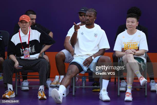 Jimmy Butler, American professional basketball player for the Miami Heat of the National Basketball Association , poses for photos with fans during...