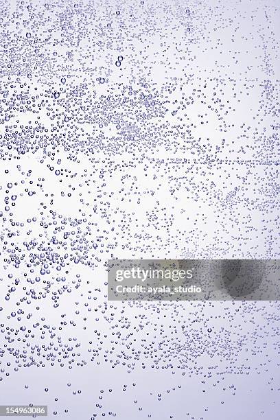 mineral water bubbles - carbonated water stock pictures, royalty-free photos & images