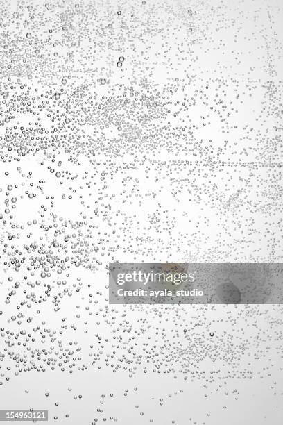 mineral water bubbles floating horizontally - carbonated drink stock pictures, royalty-free photos & images