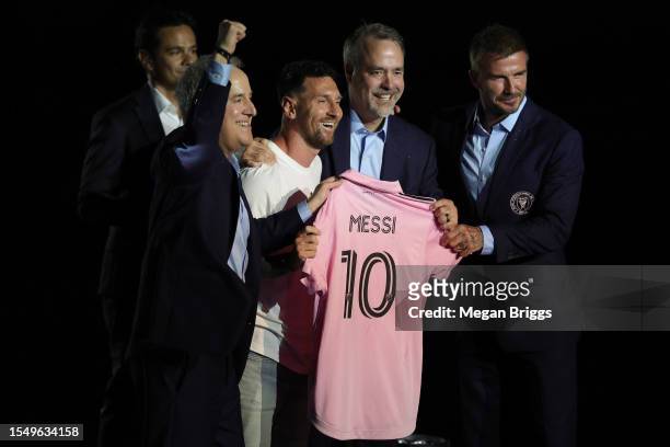 Managing Owner Jorge Mas, Lionel Messi, Co-Owner Jose Mas, and Co-Owner David Beckham pose during "The Unveil" introducing Lionel Messi hosted by...