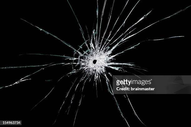 broken glass - bullet holes stockfoto's en -beelden