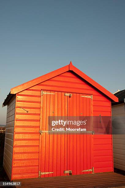 red beach hut - wood shed stock pictures, royalty-free photos & images