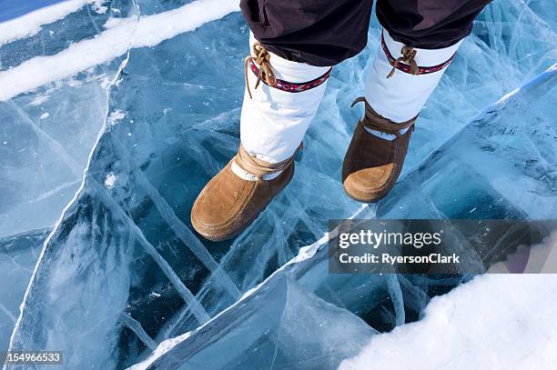 traditional mukluks or boots on ice. - yellowknife canada stockfoto's en -beelden