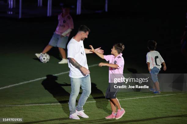 Lionel Messi interacts with his son during "The Unveil" introducing Lionel Messi hosted by Inter Miami CF at DRV PNK Stadium on July 16, 2023 in Fort...